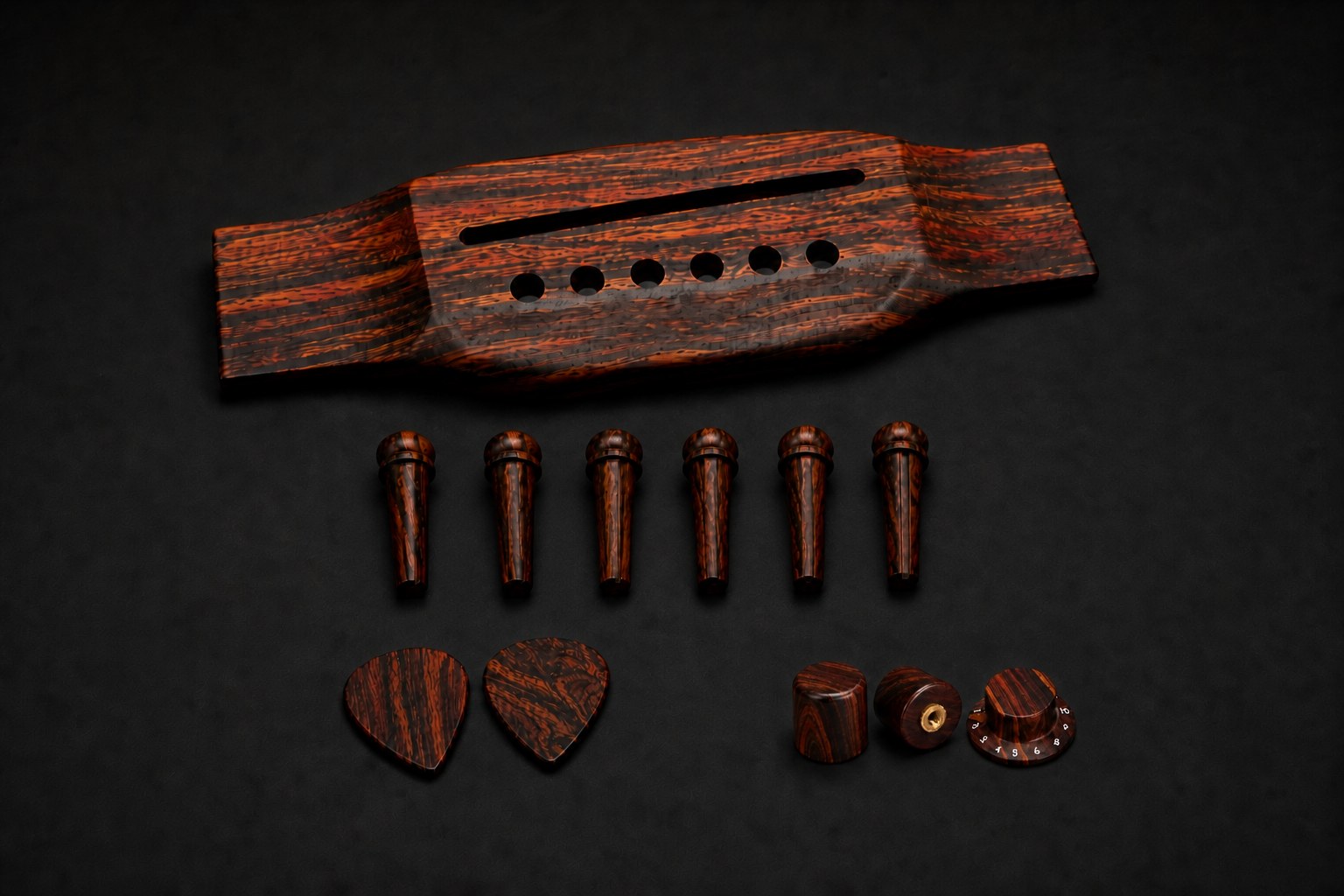 Cocobolo bridge, six bridge pins, compact control knobs and two picks for luthiers